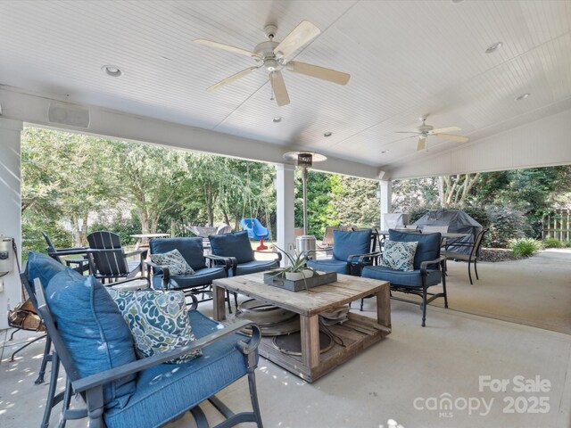 13930 Daltrey Ln, Charlotte, NC 28277 - view of patio with an outdoor living space, a ceiling fan, and outdoor dining area