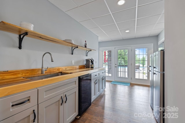 330 Waters Rd, Salisbury, NC 28146 - kitchen with open shelves, dishwashing machine, freestanding refrigerator, dark wood-type flooring, and a drop ceiling