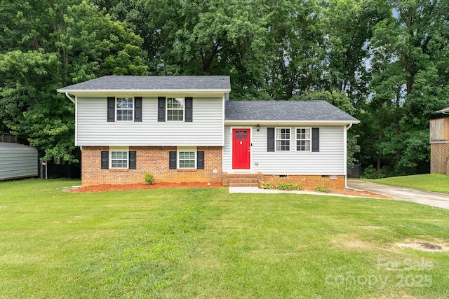 611 King Arthur Dr, Gastonia, NC 28056 - tri-level home with a front lawn, roof with shingles, crawl space, and brick siding