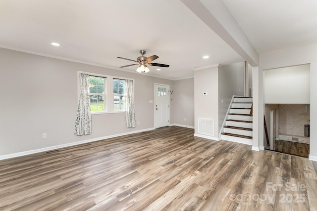 611 King Arthur Dr, Gastonia, NC 28056 - unfurnished living room with stairway, wood finished floors, recessed lighting, ornamental molding, and ceiling fan