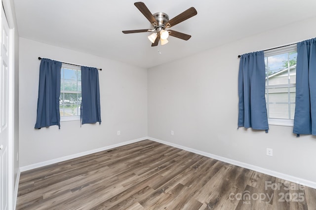 611 King Arthur Dr, Gastonia, NC 28056 - unfurnished room with wood finished floors, plenty of natural light, and ceiling fan
