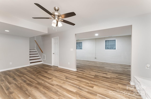 611 King Arthur Dr, Gastonia, NC 28056 - below grade area with stairs, ceiling fan, wood finished floors, recessed lighting, and concrete block wall