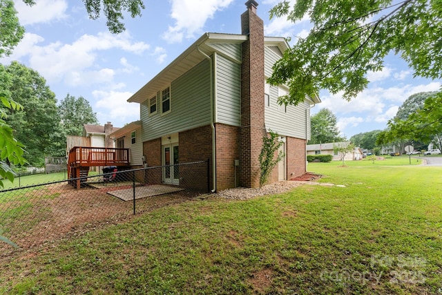 611 King Arthur Dr, Gastonia, NC 28056 - rear view of property with brick siding, a chimney, and a wooden deck