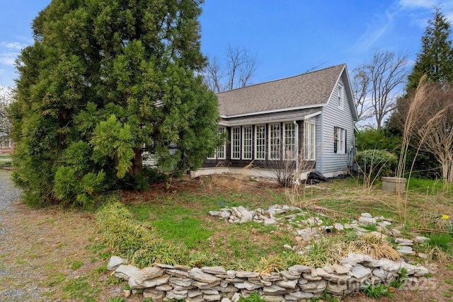 3809 Union Hill Rd, East Bend, NC 27018 - view of side of home with roof with shingles and a sunroom