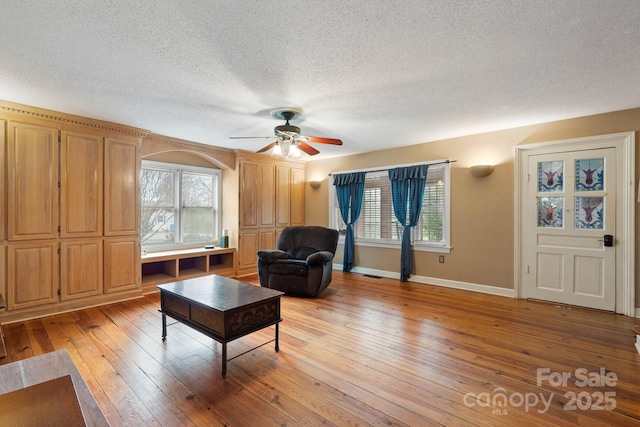 3809 Union Hill Rd, East Bend, NC 27018 - sitting room with ceiling fan, light wood-style floors, plenty of natural light, and a textured ceiling