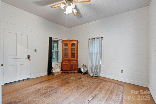 3809 Union Hill Rd, East Bend, NC 27018 - unfurnished room featuring light wood-type flooring, ceiling fan, and wooden walls