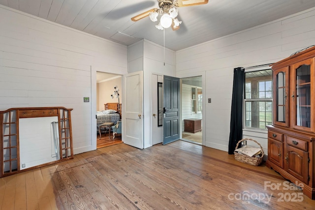 3809 Union Hill Rd, East Bend, NC 27018 - bedroom with wooden walls, hardwood / wood-style floors, and ensuite bathroom