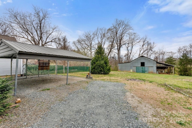 3809 Union Hill Rd, East Bend, NC 27018 - view of yard with a carport, gravel driveway, and an outdoor structure