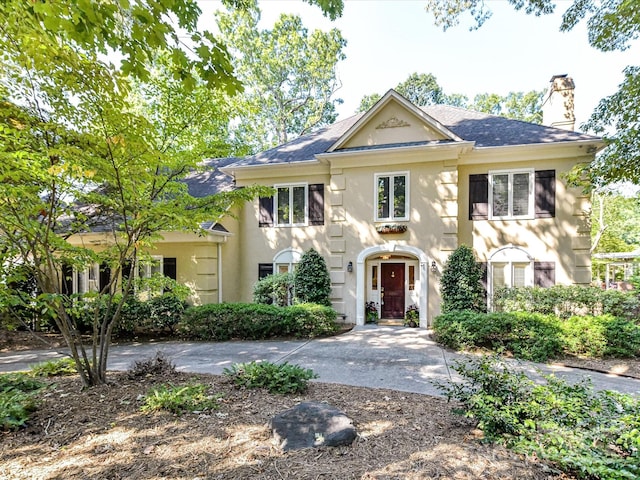 6546 Chestnut Grove Ln, Charlotte, NC 28210 - view of front facade featuring a chimney, stucco siding, and a shingled roof