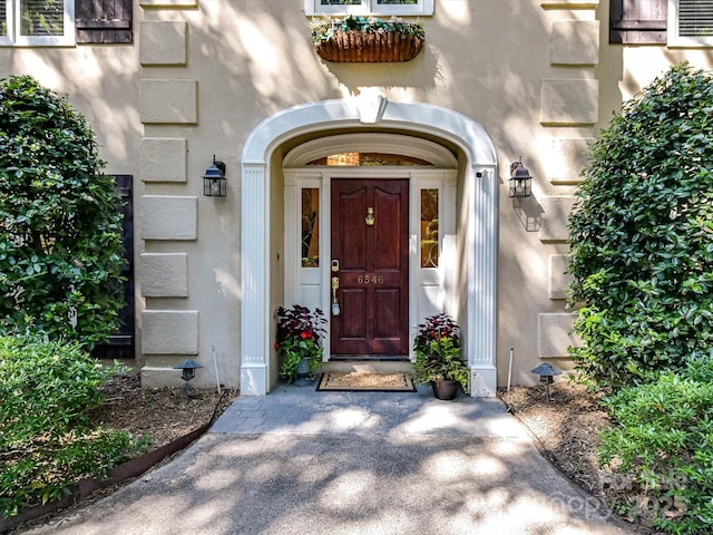 6546 Chestnut Grove Ln, Charlotte, NC 28210 - view of exterior entry with stucco siding