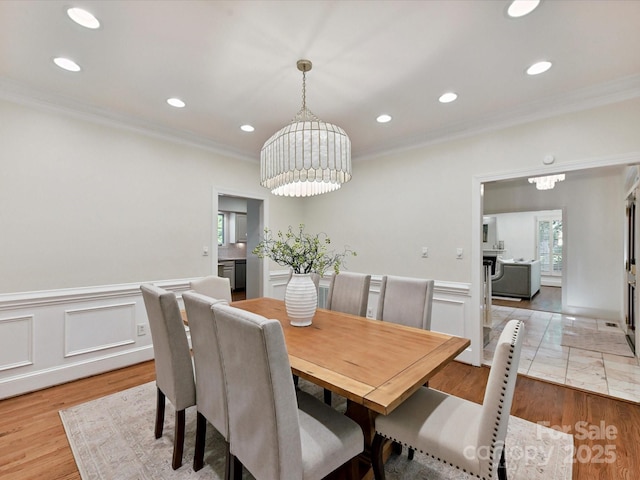 6546 Chestnut Grove Ln, Charlotte, NC 28210 - dining room featuring crown molding, a chandelier, recessed lighting, and wainscoting