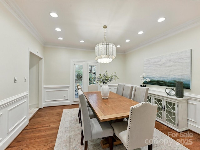 6546 Chestnut Grove Ln, Charlotte, NC 28210 - dining space featuring crown molding, recessed lighting, a wainscoted wall, wood finished floors, and a chandelier