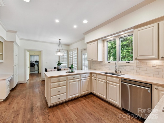 6546 Chestnut Grove Ln, Charlotte, NC 28210 - kitchen featuring dishwasher, ornamental molding, separate washer and dryer, a peninsula, and light countertops