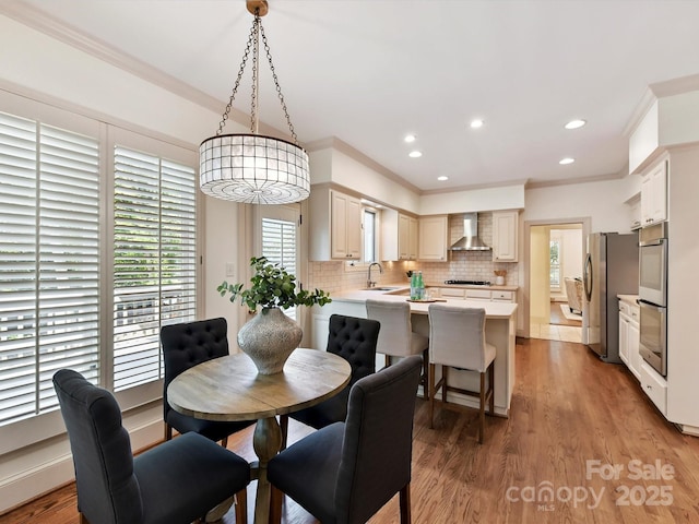 6546 Chestnut Grove Ln, Charlotte, NC 28210 - dining area featuring ornamental molding, light wood finished floors, and recessed lighting
