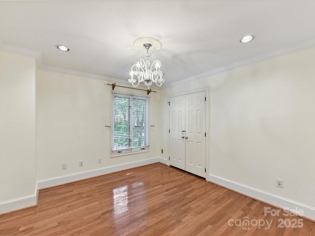 6546 Chestnut Grove Ln, Charlotte, NC 28210 - empty room featuring a chandelier, crown molding, light wood-type flooring, and recessed lighting