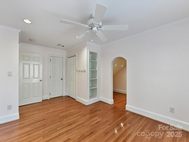 6546 Chestnut Grove Ln, Charlotte, NC 28210 - unfurnished room with a ceiling fan, light wood-style floors, crown molding, arched walkways, and recessed lighting