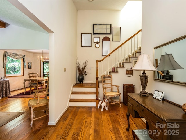 19 Jasmine Pl, Laurel Park, NC 28739 - stairway with wood finished floors and a chandelier