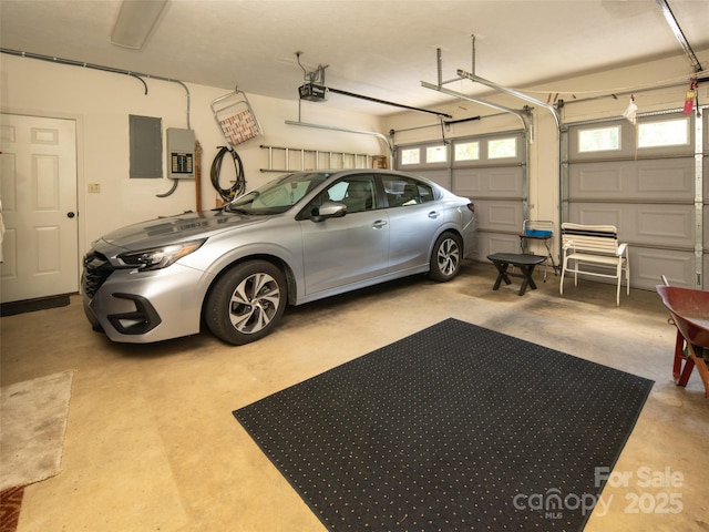 19 Jasmine Pl, Laurel Park, NC 28739 - garage featuring a garage door opener and electric panel