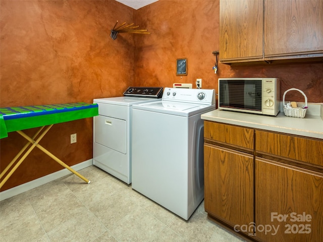 19 Jasmine Pl, Laurel Park, NC 28739 - laundry area with separate washer and dryer, cabinet space, and light floors