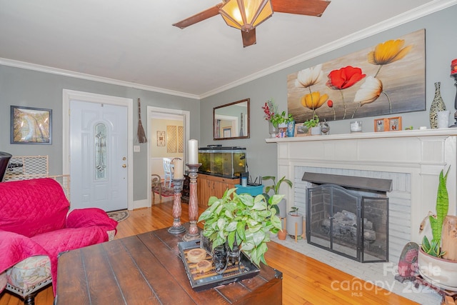 705 Townsend Ave, Gastonia, NC 28052 - living area featuring hardwood / wood-style flooring, a fireplace, crown molding, and ceiling fan