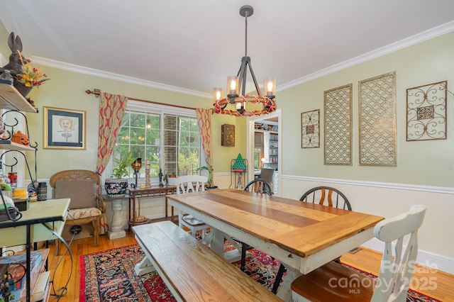 705 Townsend Ave, Gastonia, NC 28052 - dining room featuring wood finished floors, crown molding, and a chandelier