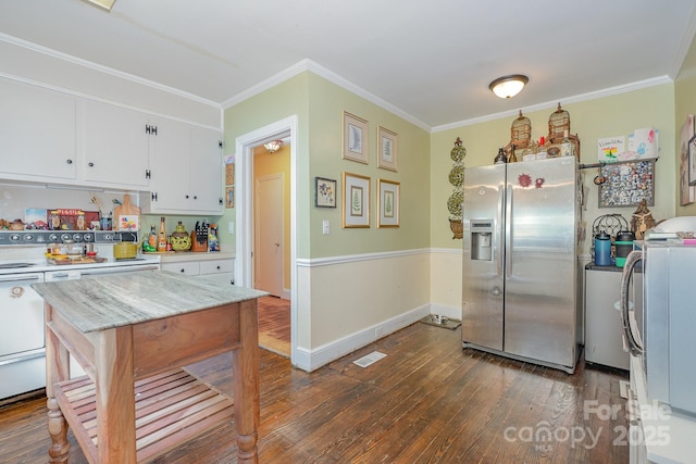 705 Townsend Ave, Gastonia, NC 28052 - kitchen with stainless steel fridge with ice dispenser, dark wood finished floors, white cabinetry, ornamental molding, and washer / dryer