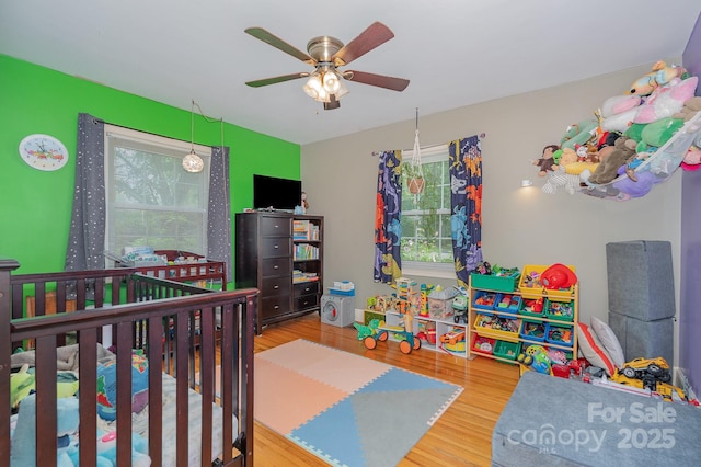 705 Townsend Ave, Gastonia, NC 28052 - bedroom with multiple windows, wood finished floors, and ceiling fan