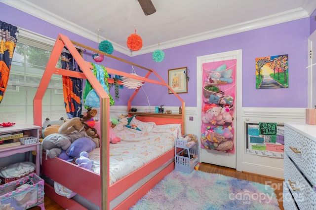 705 Townsend Ave, Gastonia, NC 28052 - bedroom with crown molding, a wainscoted wall, wood finished floors, and a ceiling fan