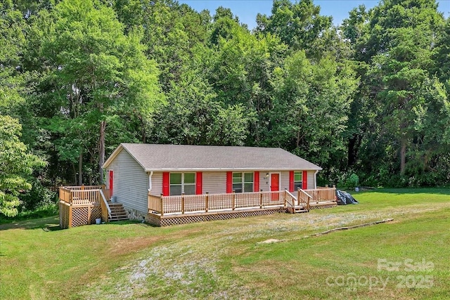 2611 Dallas Stanley Hwy, Stanley, NC 28164 - view of front of home with a front lawn, a wooden deck, and a wooded view