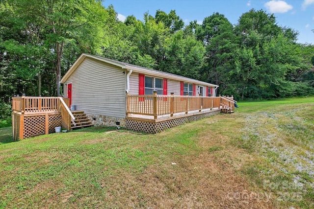 2611 Dallas Stanley Hwy, Stanley, NC 28164 - view of home's exterior featuring a wooden deck, a yard, and crawl space