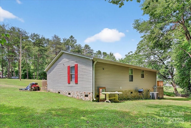 2611 Dallas Stanley Hwy, Stanley, NC 28164 - view of home's exterior with crawl space and a lawn