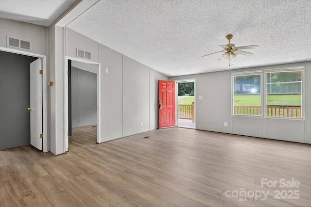 2611 Dallas Stanley Hwy, Stanley, NC 28164 - unfurnished room featuring lofted ceiling, ceiling fan, a textured ceiling, and wood finished floors