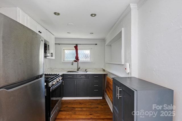 351 Dove Haven Ln, Hendersonville, NC 28791 - kitchen featuring stainless steel appliances, white cabinetry, dark wood-style floors, and ornamental molding
