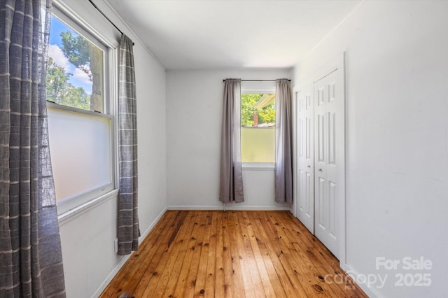 351 Dove Haven Ln, Hendersonville, NC 28791 - unfurnished bedroom featuring hardwood / wood-style floors and a closet