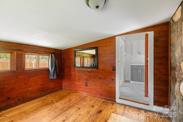 351 Dove Haven Ln, Hendersonville, NC 28791 - spare room with lofted ceiling, hardwood / wood-style floors, plenty of natural light, and wood walls