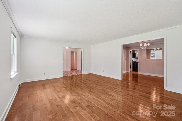 3333 Tanglewood Dr, Rock Hill, SC 29732 - spare room with a chandelier, wood finished floors, crown molding, and a textured ceiling