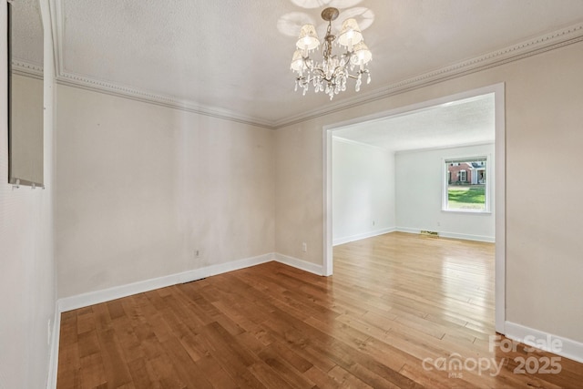 3333 Tanglewood Dr, Rock Hill, SC 29732 - empty room featuring a chandelier, crown molding, and wood finished floors