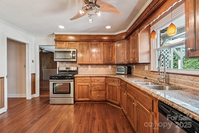 3333 Tanglewood Dr, Rock Hill, SC 29732 - kitchen with appliances with stainless steel finishes, ceiling fan, brown cabinets, dark wood-type flooring, and ornamental molding