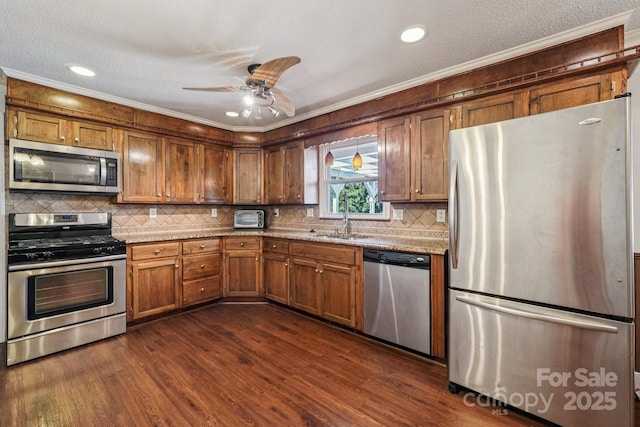 3333 Tanglewood Dr, Rock Hill, SC 29732 - kitchen featuring stainless steel appliances, ornamental molding, dark wood-style flooring, decorative backsplash, and a ceiling fan