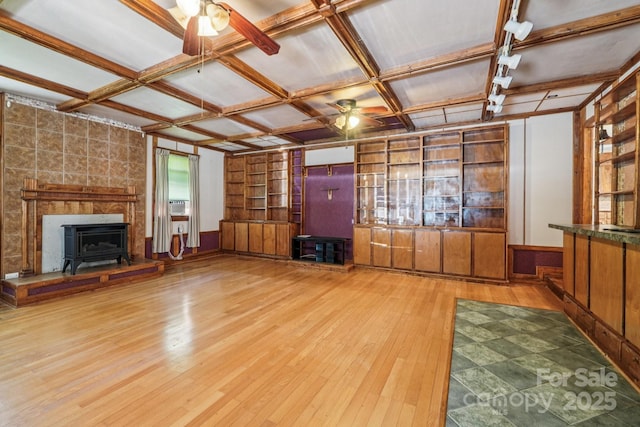 3333 Tanglewood Dr, Rock Hill, SC 29732 - unfurnished living room with ceiling fan, coffered ceiling, a wood stove, hardwood / wood-style flooring, and built in shelves