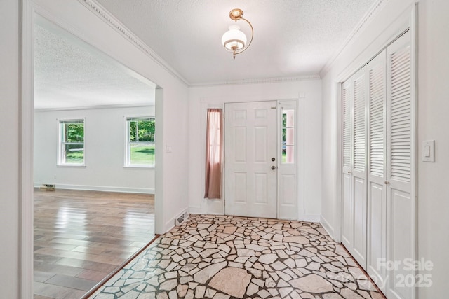 3333 Tanglewood Dr, Rock Hill, SC 29732 - foyer entrance featuring a textured ceiling, ornamental molding, and light wood finished floors