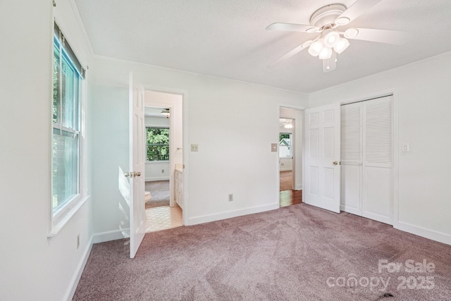 3333 Tanglewood Dr, Rock Hill, SC 29732 - unfurnished bedroom featuring carpet floors, multiple windows, a ceiling fan, and a closet