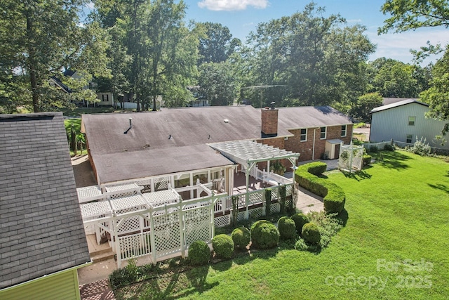 3333 Tanglewood Dr, Rock Hill, SC 29732 - back of property with a deck, a yard, a chimney, roof with shingles, and view of scattered trees