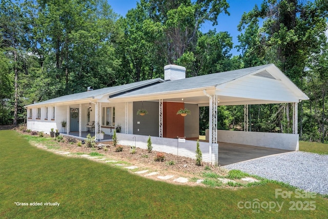 6939 Knob Ave, Connelly Springs, NC 28612 - ranch-style house with a front yard, a chimney, covered porch, a carport, and gravel driveway