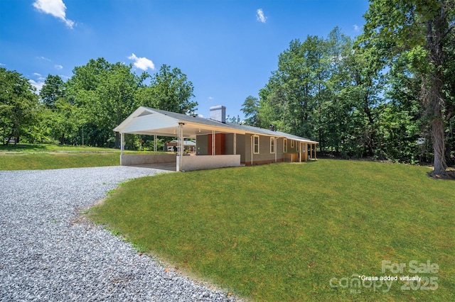 6939 Knob Ave, Connelly Springs, NC 28612 - view of front of property with driveway, a front yard, an attached carport, and a chimney
