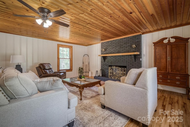 6939 Knob Ave, Connelly Springs, NC 28612 - living area featuring wood ceiling, wood finished floors, a fireplace, and ceiling fan