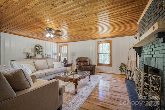 6939 Knob Ave, Connelly Springs, NC 28612 - living area featuring wooden ceiling, ceiling fan, light wood-style flooring, and a brick fireplace