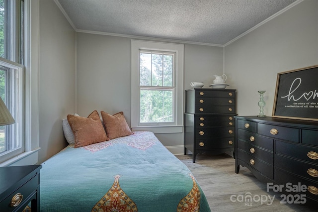6939 Knob Ave, Connelly Springs, NC 28612 - bedroom with wood finished floors, a textured ceiling, multiple windows, and crown molding
