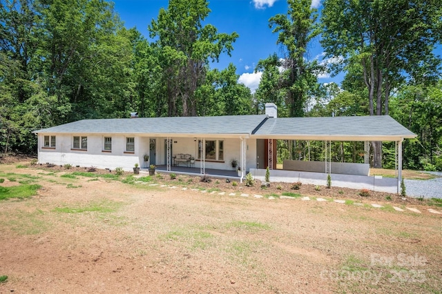 6939 Knob Ave, Connelly Springs, NC 28612 - single story home with covered porch, a chimney, and an attached carport