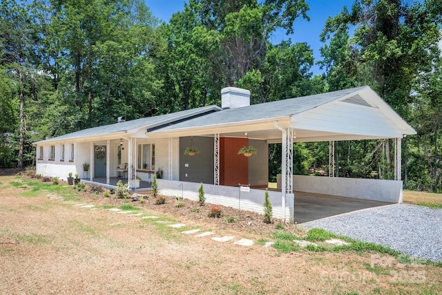 6939 Knob Ave, Connelly Springs, NC 28612 - ranch-style house featuring a chimney, covered porch, a carport, and driveway